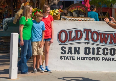 Image of people at Old Town San Diego Historic Park sign