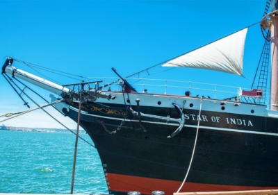 The bow of tall ship Star of India with its large anchor affixed to the side in San Diego