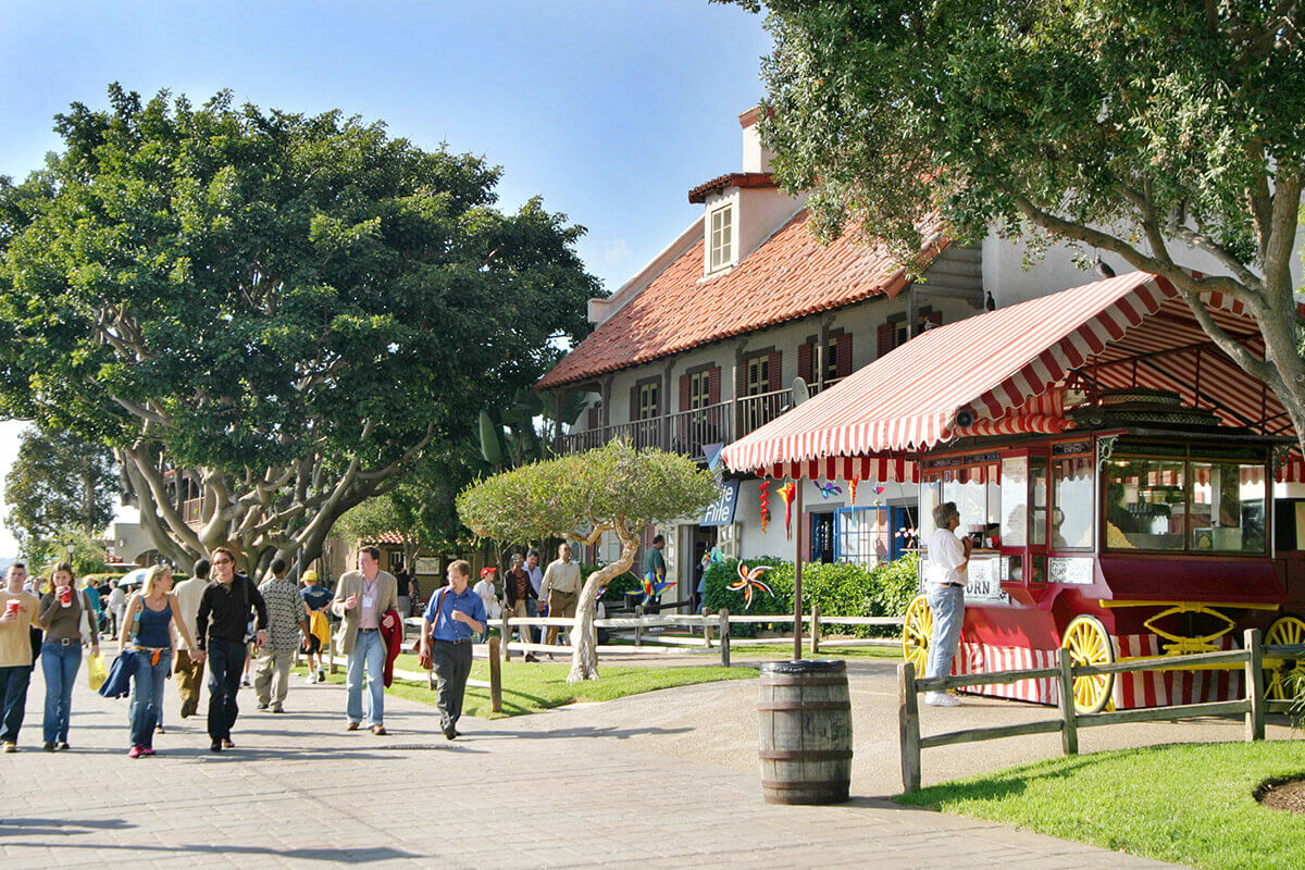 visitors walking at seaport village on a sunny day