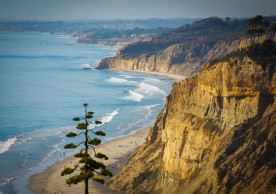 Torrey Pines State Natural Reserve is a remarkable destination for nature photographers and hikers alike. The trails weave through coastal cliffs which offer panoramic views of the Pacific Ocean and dramatic rock formations shaped by centuries of wind and waves. Along the way, you’ll encounter native flora, including the rare Torrey pine trees that give the reserve its name. For those seeking unique shots, the reserve’s overlook points are ideal for capturing the interplay of light and shadow across the rugged cliffs and expansive ocean. At the foot of the trails, the beach provides a pristine setting where waves crash against the shoreline, creating a dynamic and ever-changing subject for your photos. With its stunning vistas and natural beauty, Torrey Pines is undeniably one of the most unforgettable Instagrammable places in San Diego.